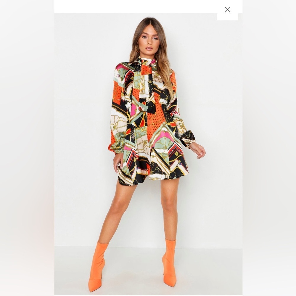 Multi color short dress with long sleeves. Stretchy comfortable . Worn once